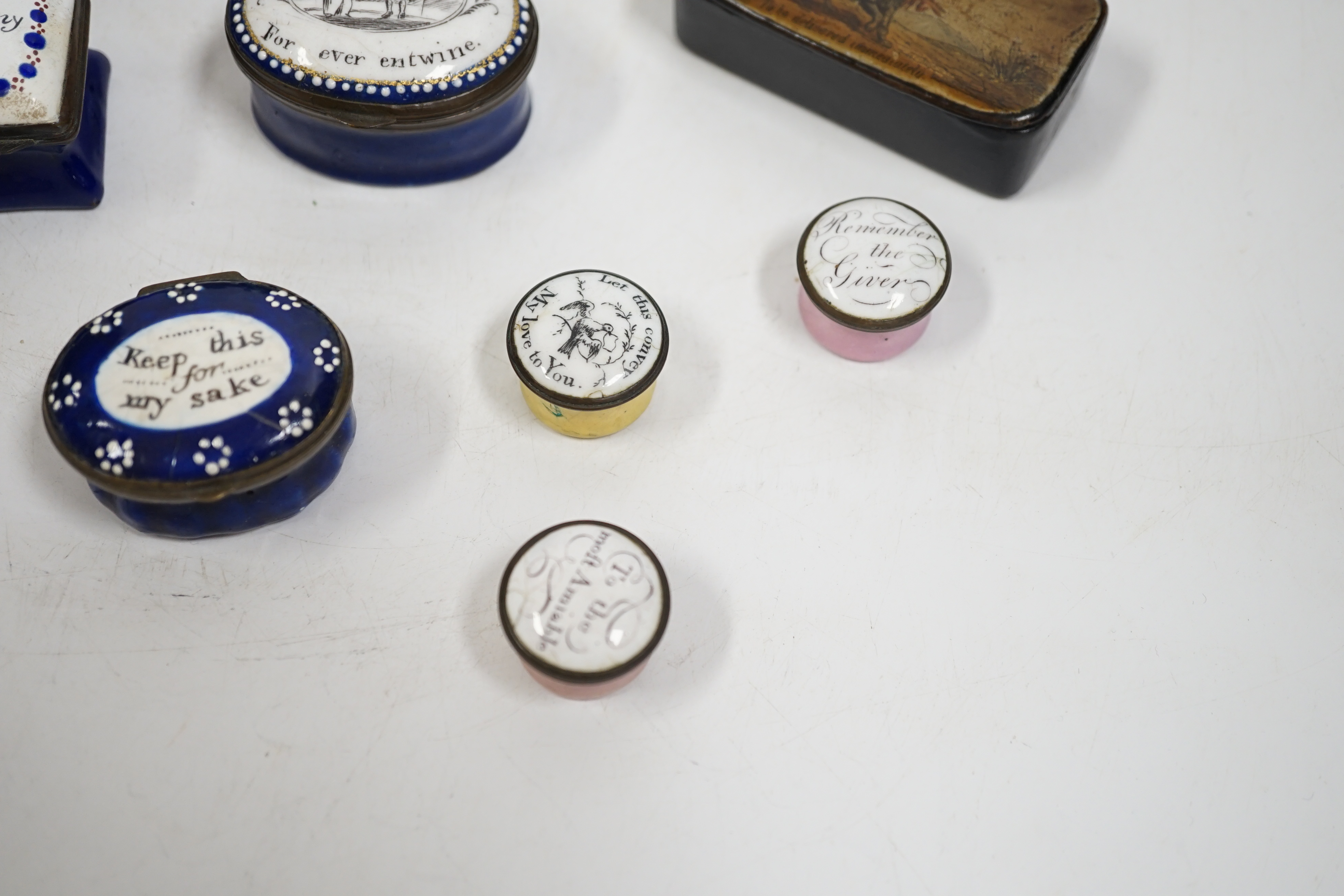 Two South Staffordshire enamel sweetheart patch boxes and two similar snuff boxes, three South Staffordshire enamel pill boxes, all late 18th/early 19th century, South Staffordshire enamel cup and associated cover and a